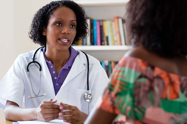 A female doctor talking to a patient 