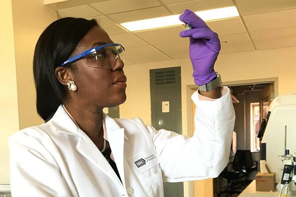 Dr. Paule Joseph working in a laboratory