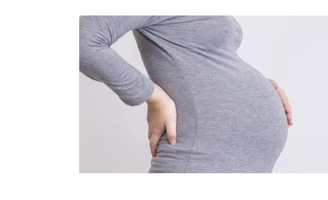 Image of a pregnant woman with her hand over her abdomen