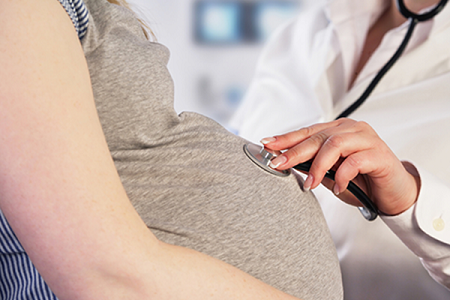 image of a pregnant woman being seen by a doctor