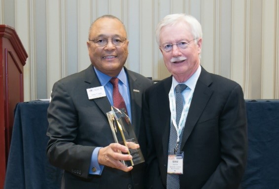 Dr. Koob receiving the CADCA 2019 National Leadership Award from CADCA CEO General Arthur Dean.