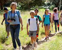 kids and teacher hiking