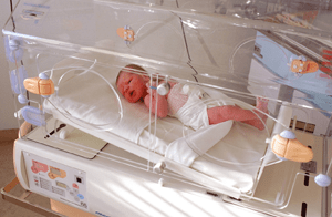 Photo of infant in incubator