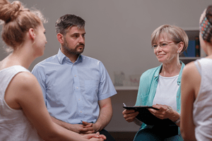 family talking to practitioner