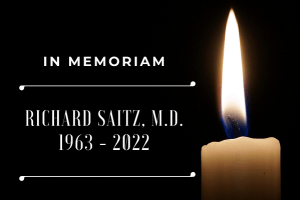 candle burning in honor of Richard Saitz